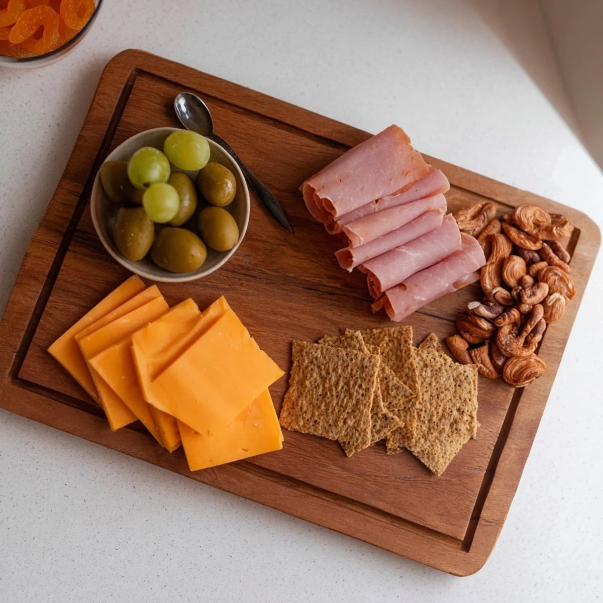 Elegant charcuterie board for one; a simple appetizer with meats, cheese, grapes, and nuts.