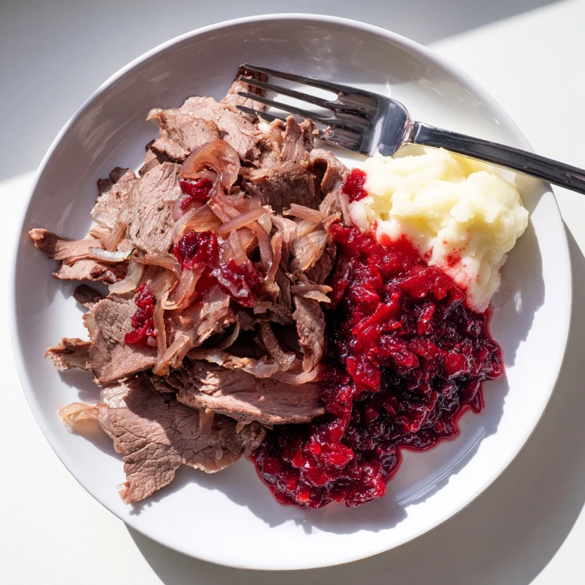 Finnish Reindeer Stew, a hearty dish with tender meat and creamy sour cream, ready to serve.