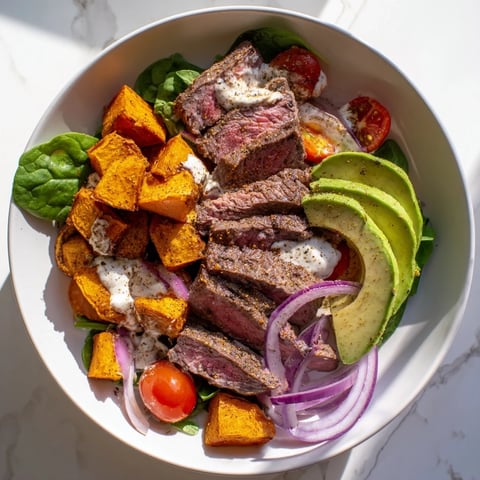 Tender beef avocado sweet potato bowl with vibrant colors, perfect for a healthy lunch.
