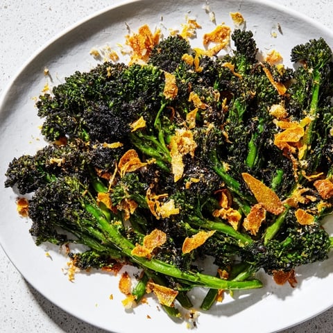 Charred Broccolini Salad with crispy garlic and Parmesan, a flavorful vegetarian side dish.