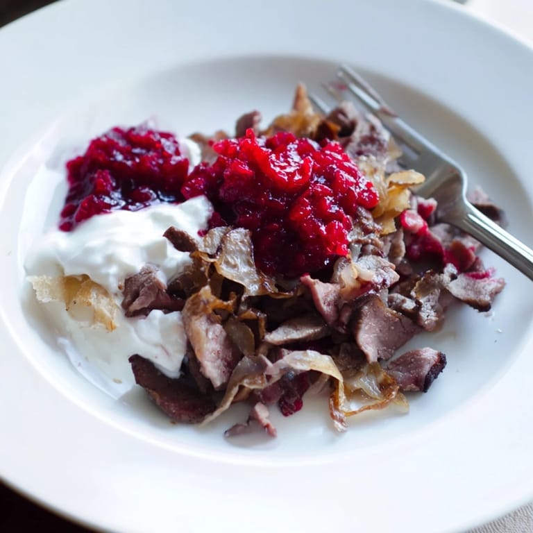 Slow-cooked Finnish Reindeer Stew, imagine the tender meat and rich gravy, served with mashed potatoes.